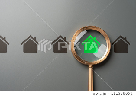Magnifying glass and green house. High energy efficiency. Green technologies in construction. Ecological housing. Self-sufficient, autonomous and zero carbon emissions. Minimal impact on environment. 111539059