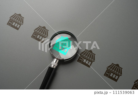 Magnifying glass and store. Shops and commercial real estate. Open a business in a high foot traffic areas, accessibility. An investment opportunity. Choose a business franchise for investment. Magnifying glass and store. Shops and commercial real estate. Open a business in a high foot traffic areas, accessibility. An investment opportunity. Choose a business franchise for investment. 111539063