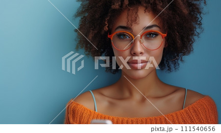 AI-generated content. On a blue backdrop, an attractive young latin woman holding her cellphone is smiling happily, doing online shopping, using apps on her smartphone, looking aside at copy space. 111540656