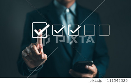Checklist concept. Businessman tick correct sign mark in checkbox for quality document control checklist. Online test, Checkmark, Filling out digital form, Exam, Business technology. Project approval. Checklist concept. Businessman tick correct sign mark in checkbox for quality document control checklist. Online test, Checkmark, Filling out digital form, Exam, Business technology. Project approval. 111542326