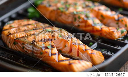 Fire grilled salmon steaks 111542667
