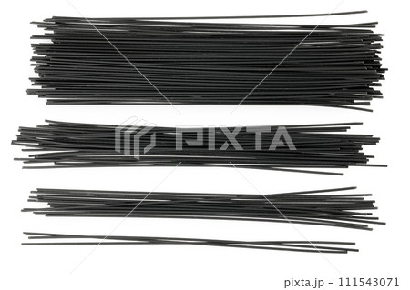 uncooked black spaghetti isolated on white background. Top view. Flat lay 111543071
