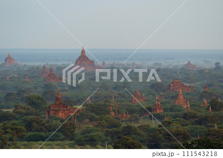 Aerial top view of burmese temples of Bagan City from a balloon, unesco world heritage with forest trees, Myanmar or Burma. Tourist destination. Aerial top view of burmese temples of Bagan City from a balloon, unesco world heritage with forest trees, Myanmar or Burma. Tourist destination. 111543218
