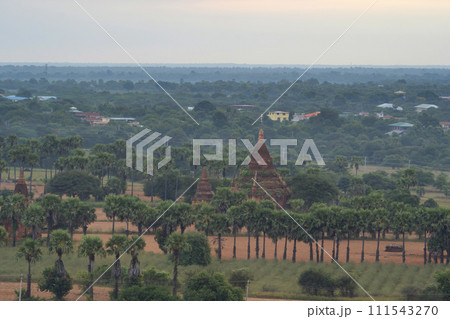 Aerial top view of burmese temples of Bagan City from a balloon, unesco world heritage with forest trees, Myanmar or Burma. Tourist destination. Aerial top view of burmese temples of Bagan City from a balloon, unesco world heritage with forest trees, Myanmar or Burma. Tourist destination. 111543270