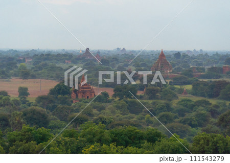 Aerial top view of burmese temples of Bagan City from a balloon, unesco world heritage with forest trees, Myanmar or Burma. Tourist destination. Aerial top view of burmese temples of Bagan City from a balloon, unesco world heritage with forest trees, Myanmar or Burma. Tourist destination. 111543279