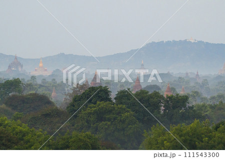 Aerial top view of burmese temples of Bagan City from a balloon, unesco world heritage with forest trees, Myanmar or Burma. Tourist destination. Aerial top view of burmese temples of Bagan City from a balloon, unesco world heritage with forest trees, Myanmar or Burma. Tourist destination. 111543300