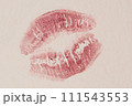 Lipstick kiss on white paper background. Close-up. 111543553