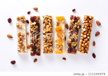 Granola bars with nuts and dried fruits on white background, top view 111544979