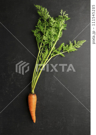 Fresh carrots and beets on a dark wooden background. Vegan dinner . Dietary product. Healthy food. Fresh carrots and beets on a dark wooden background. Vegan dinner . Dietary product. Healthy food. 111545285