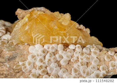 Macro stone Aragonite mineral on a black background Macro stone Aragonite mineral on a black background 111548202