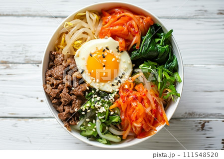 Beef bibimbap on a white wooden background, traditional korean cuisine top view 111548520