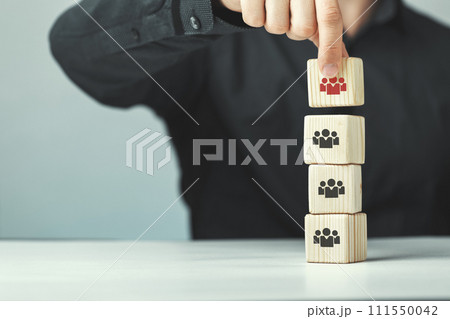 Assembled wooden cubes on the theme of business leadership 111550042