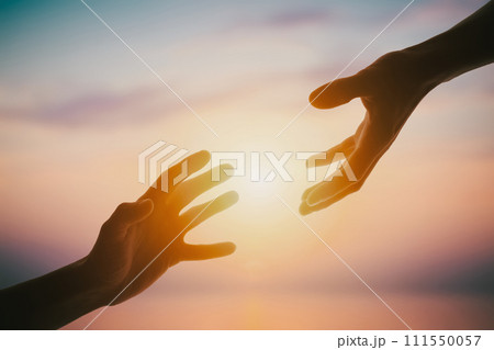 Giving a helping hand on sunset Giving a helping hand on sunset 111550057