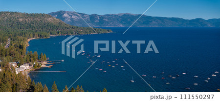 Beautiful aerial view of the Tahoe lake from above in California, USA. Wild forests, fresh air and mountains of California. Beautiful aerial view of the Tahoe lake from above in California, USA. Wild forests, fresh air and mountains of California. 111550297