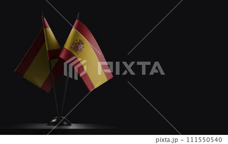 Small national flags of the Spain on a black background 111550540