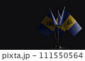 Small national flags of the Barbados on a black background 111550564