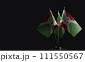 Small national flags of the Burundi on a black background 111550567
