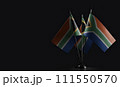 Small national flags of the South Africa on a black background 111550570