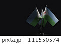 Small national flags of the Djibouti on a black background 111550574