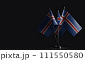 Small national flags of the Iceland on a black background 111550580