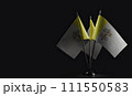 Small national flags of the Vatican on a black background 111550583