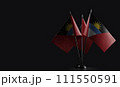 Small national flags of the Antigua and Barbuda on a black background 111550591