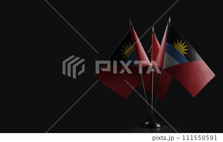 Small national flags of the Antigua and Barbuda on a black background Small national flags of the Antigua and Barbuda on a black background 111550591
