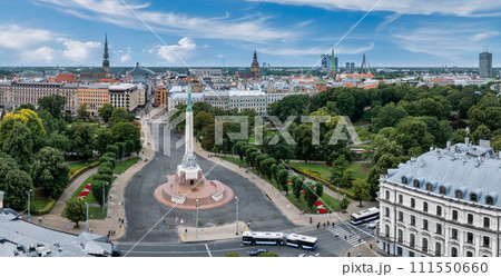 Beautiful sunrise view over Riga by the statue of liberty - Milda in Latvia. The monument of freedom. 111550660