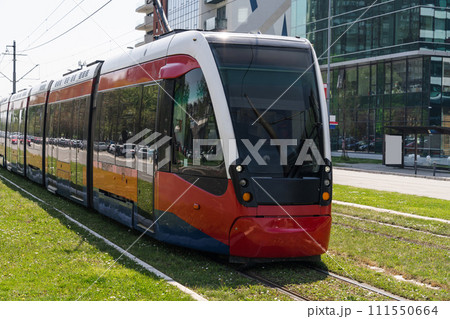 Modern tram on the city street 111550664