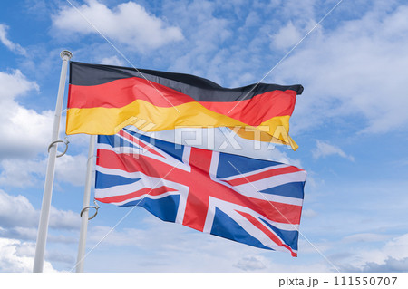 UK and German flags flutter in the wind 111550707