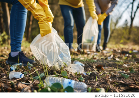 Closeup of volunteer group cleaning up litter in natural environments. Generative AI Closeup of volunteer group cleaning up litter in natural environments. Generative AI 111551020