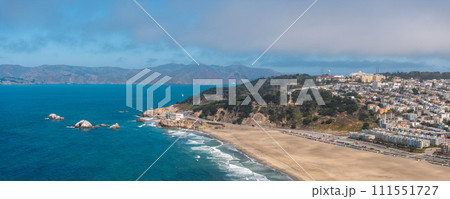 Where the sea meets the land in San Francisco. Ocean Beach is a world renowned surfing beach in the Sunset district of San Francisco. Cliff house building on the cliffs. Where the sea meets the land in San Francisco. Ocean Beach is a world renowned surfing beach in the Sunset district of San Francisco. Cliff house building on the cliffs. 111551727