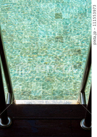 Outdoors swimming pool ladder. Summery vacations. Outdoors swimming pool ladder. Summery vacations. 111553973