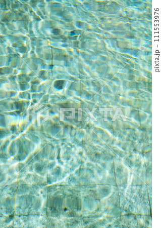 Sunshine through the ripples of water in swimming pool. Sunshine through the ripples of water in swimming pool. 111553976