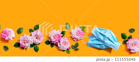 Face masks with pink roses overhead view Face masks with pink roses overhead view 111555048
