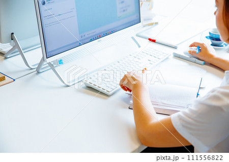 female hands typing on keyboard, woman writing letter, iMac. desktop interior designer, architect. white table, construction drawings. Astana, Nur-Sultan, Kazakhstan - 6.5.23 111556822