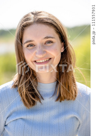 Sunny Day Portrait of a Smiling Young Woman Sunny Day Portrait of a Smiling Young Woman 111557931