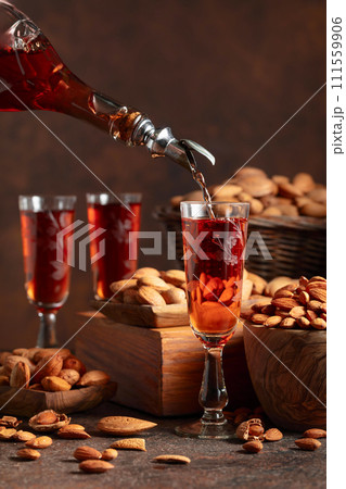Italian liqueur Amaretto with almonds nuts. Italian liqueur Amaretto with almonds nuts. 111559906