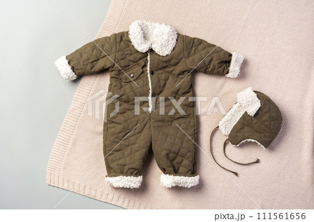 Gray quilted baby overalls for winter flat lay Gray quilted baby overalls for winter flat lay 111561656