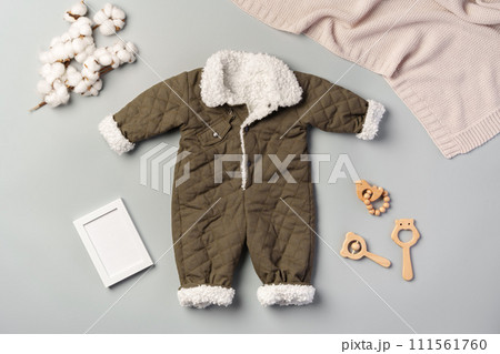 Gray quilted baby overalls for winter flat lay Gray quilted baby overalls for winter flat lay 111561760