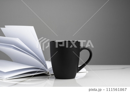 Ceramic mug on marble table on gray background Ceramic mug on marble table on gray background 111561867