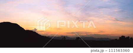 Evening time of panorama mountain under dramatic twilight sky and cloud. Nightfall Silhouette mountain on sunset. 111563360