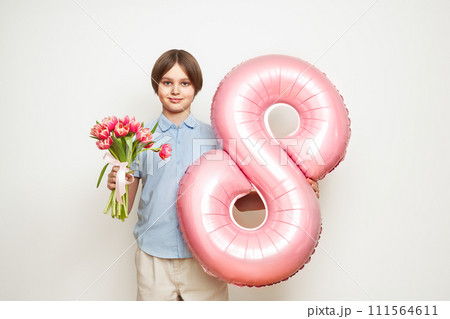 Happy child with Tulips bouquet and balloon number 8 111564611