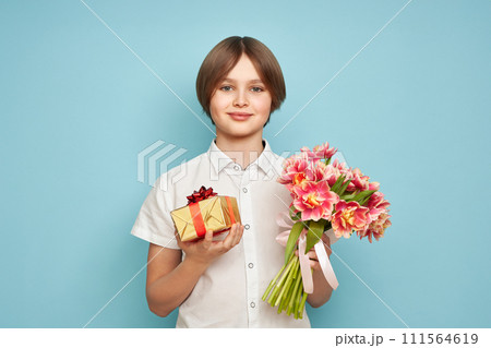 Happy child with Tulips bouquet and present 111564619