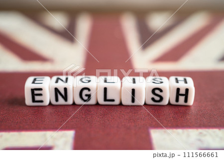 Word English on United Kingdom flag, learning English language courses concept. 111566661