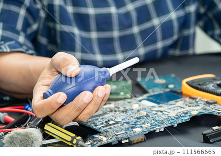 Asian technician repair and cleaning dirty micro circuit main board of smartphone electronic technology with brush, hardware, mobile phone, upgrade concept. 111566665