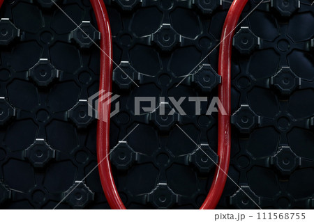 closeup of warm water underfloor heating system closeup of warm water underfloor heating system 111568755