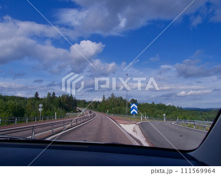 Country Road, cloudy sommar fourney in Sweden 111569964