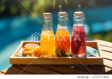 AI-generated content. summertime vibes Bottles of freshly squeezed juice standing on a wooden tray 111571982
