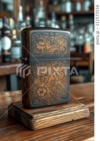 A vintage gasoline lighter for cigars stands on a stand on the table 111573558